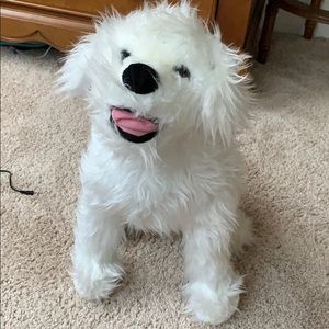 A white puppy dog stuffed animal.